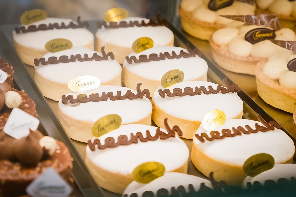 Two rows of neenish tarts from Gumnut Patisserie sit in a glass case (neenish tart)