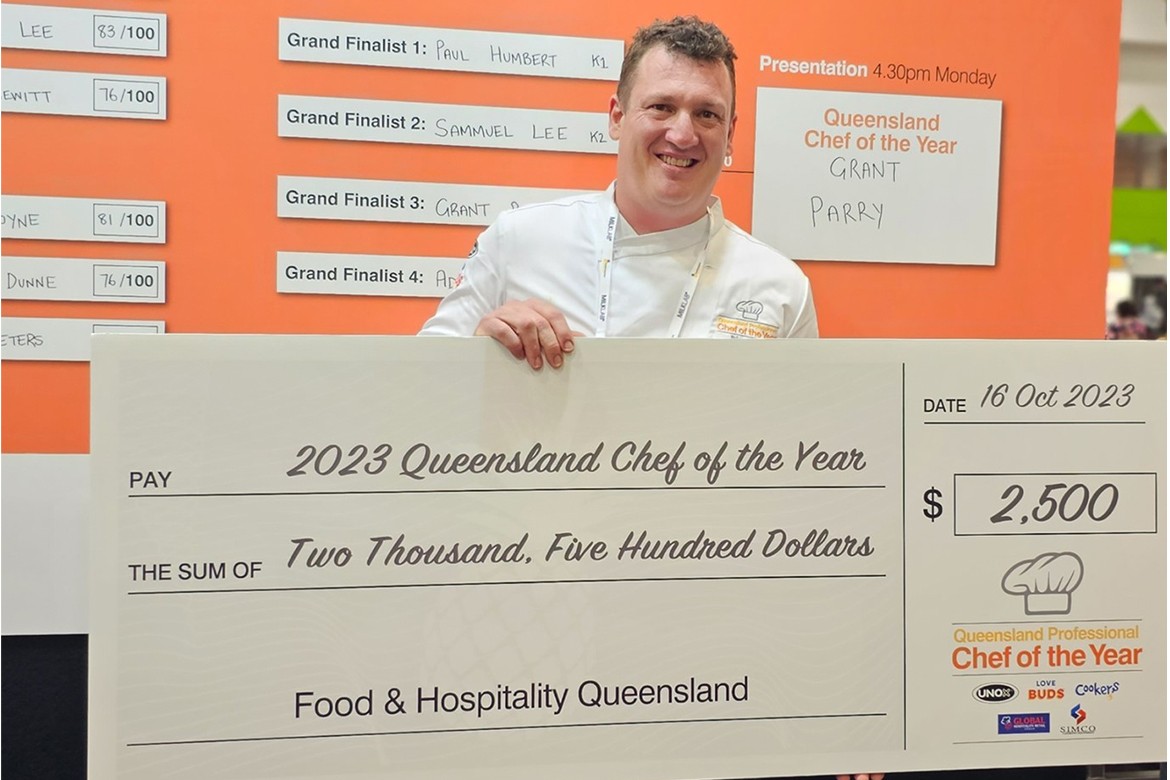 Grant Parry, winner of Queensland chef of the year with his cheque for $2,500 prize money