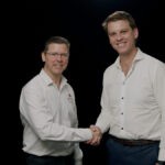 Beefy's Pies CEO Mark Hobbs (left) and RFG CEO Matt Marshall (right) shaking hands