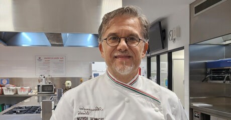 Alessandro Urilli in chefs white smiles at the camera. He will be spearheading the Panettone World Cup